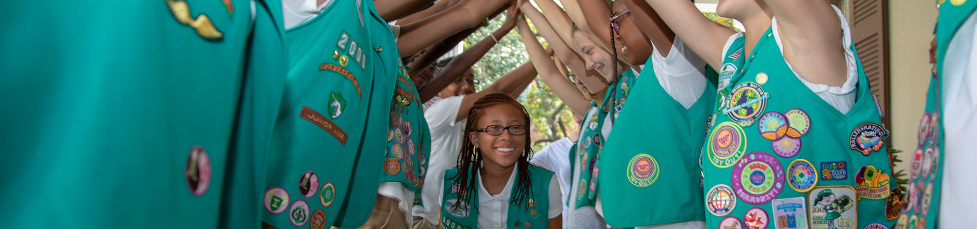  Close up image of girl scouts wearing their vests 